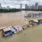 Weather tracker: Typhoon leaves people stranded on rooftops in China