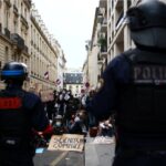 French police suspend use of stun grenades after high-school protester loses hand