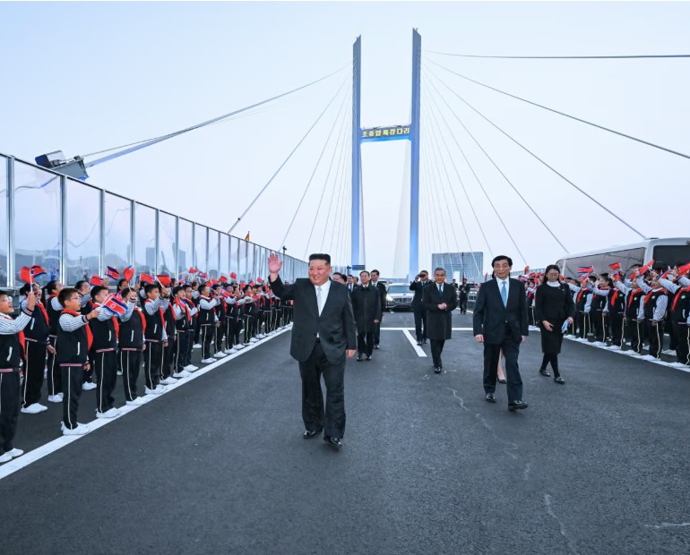Kim Jong-un crosses newly opened bridge into China